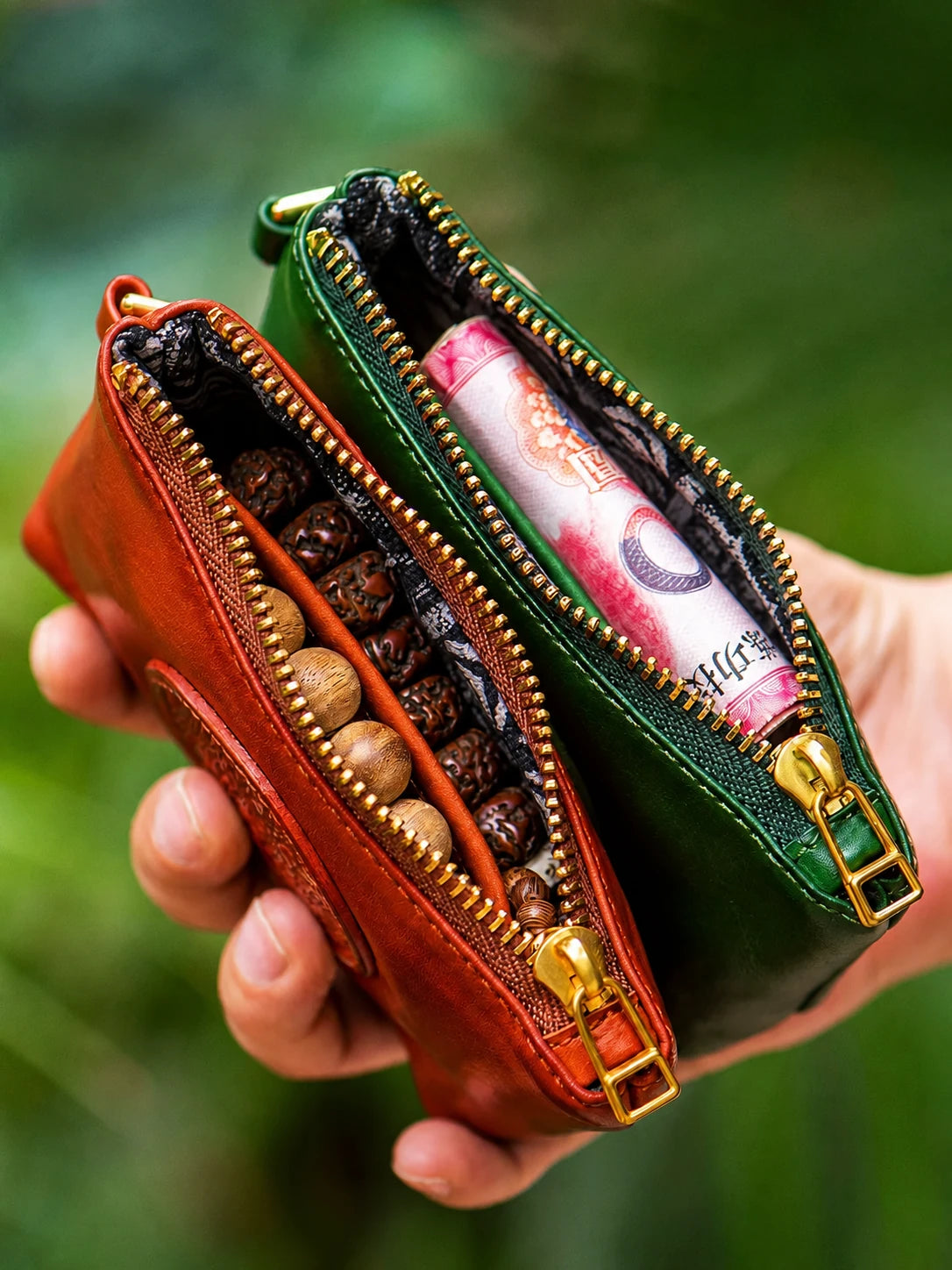 open red-brown and green mini wallets with prayer beads and cash