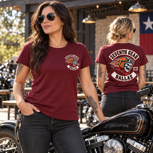 Women riders wearing Seventh Gear semi-fitted short-sleeve club T-shirts at a clubhouse courtyard.