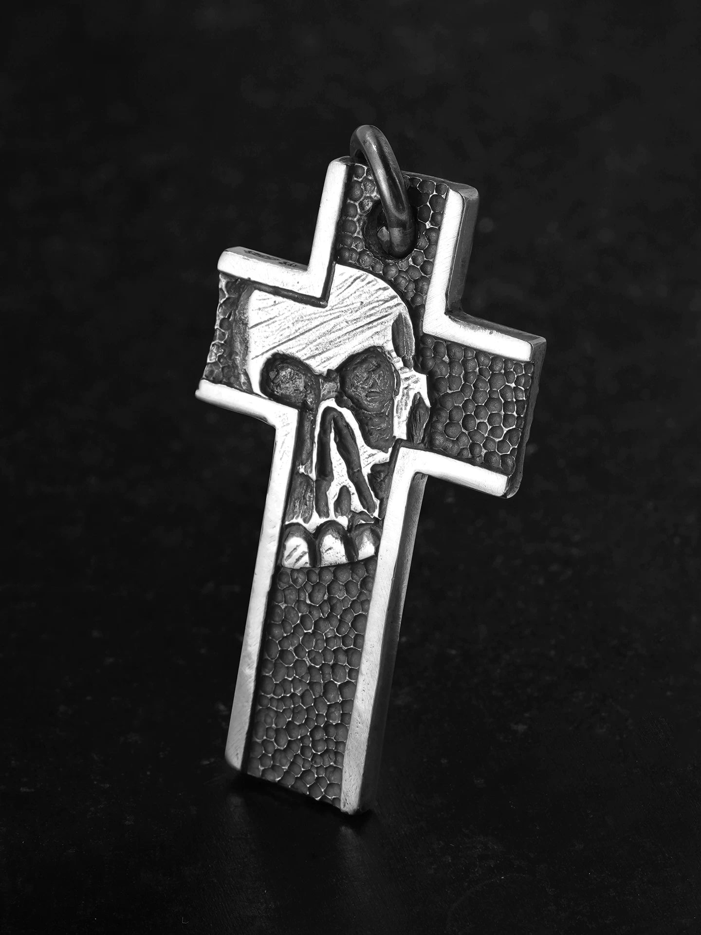 Front view of skull cross sterling silver biker pendant