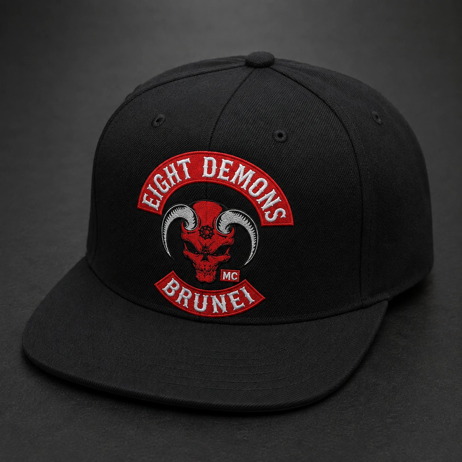 A black motorcycle club six-panel cap visibly shows balanced crown seams and a flat visor.