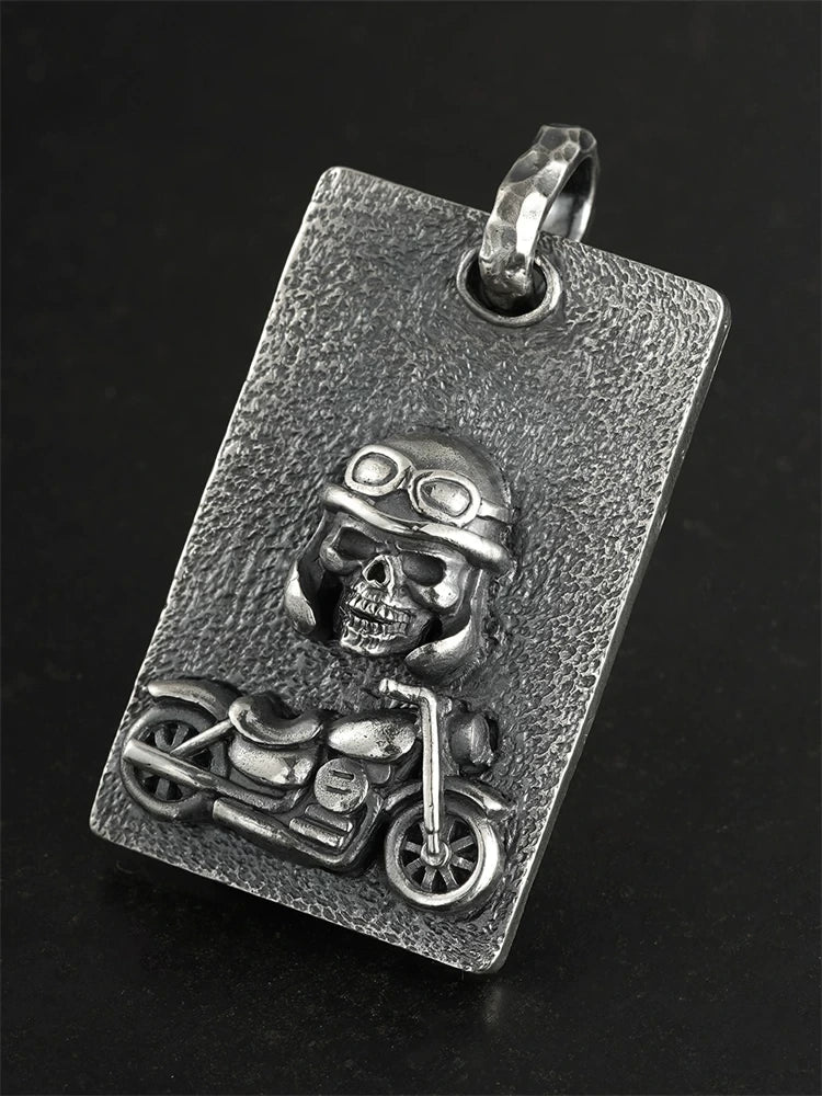 Angled view of handcrafted motorcycle skull silver pendant