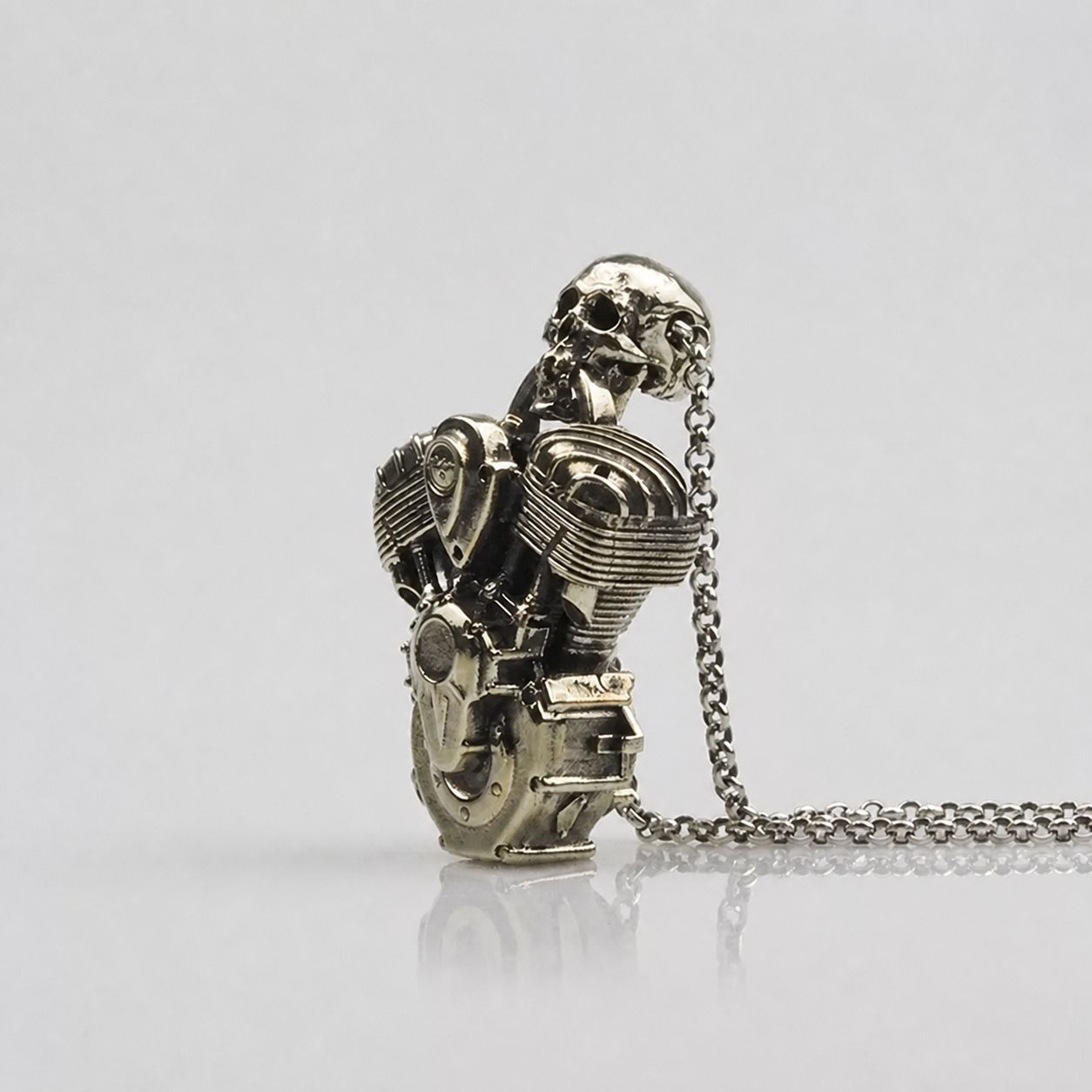 Skull V-twin engine biker pendant angled view