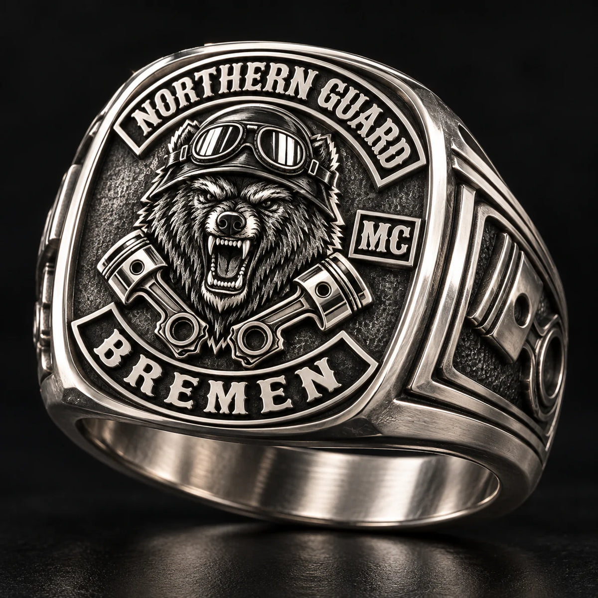 Square white copper motorcycle club ring with a raised Northern Guard emblem and broad shoulders.