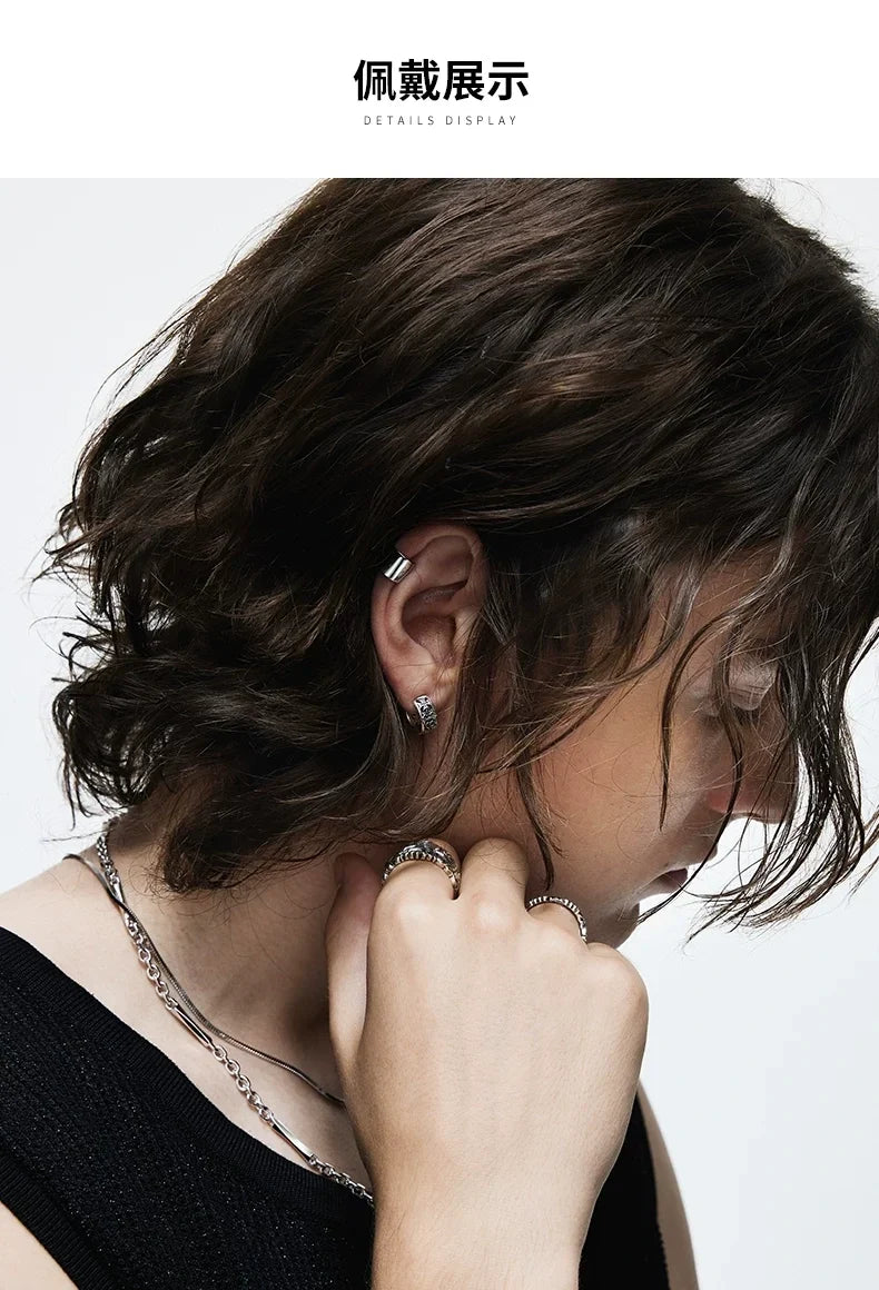 Sterling Silver Cross Clip-On Earrings for Bikers shown in a rider lifestyle view 1