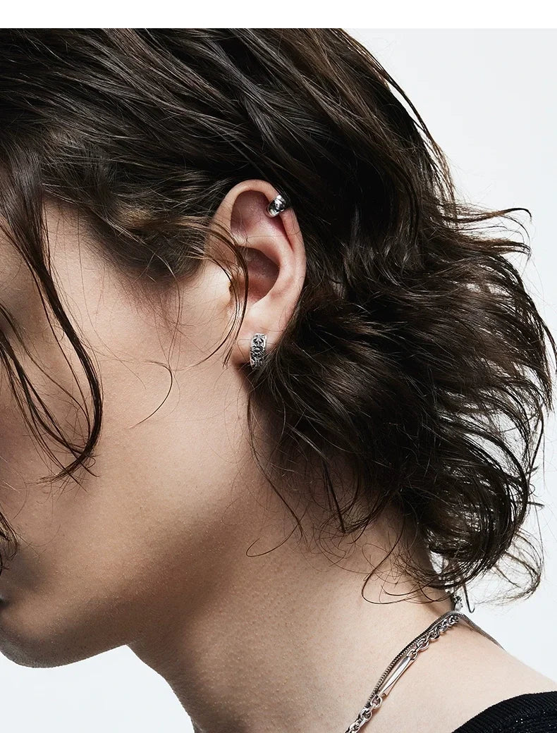Sterling Silver Cross Clip-On Earrings for Bikers shown in a rider lifestyle view 2
