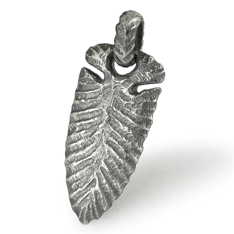 Stone Age spearhead sterling silver biker pendant isolated on white