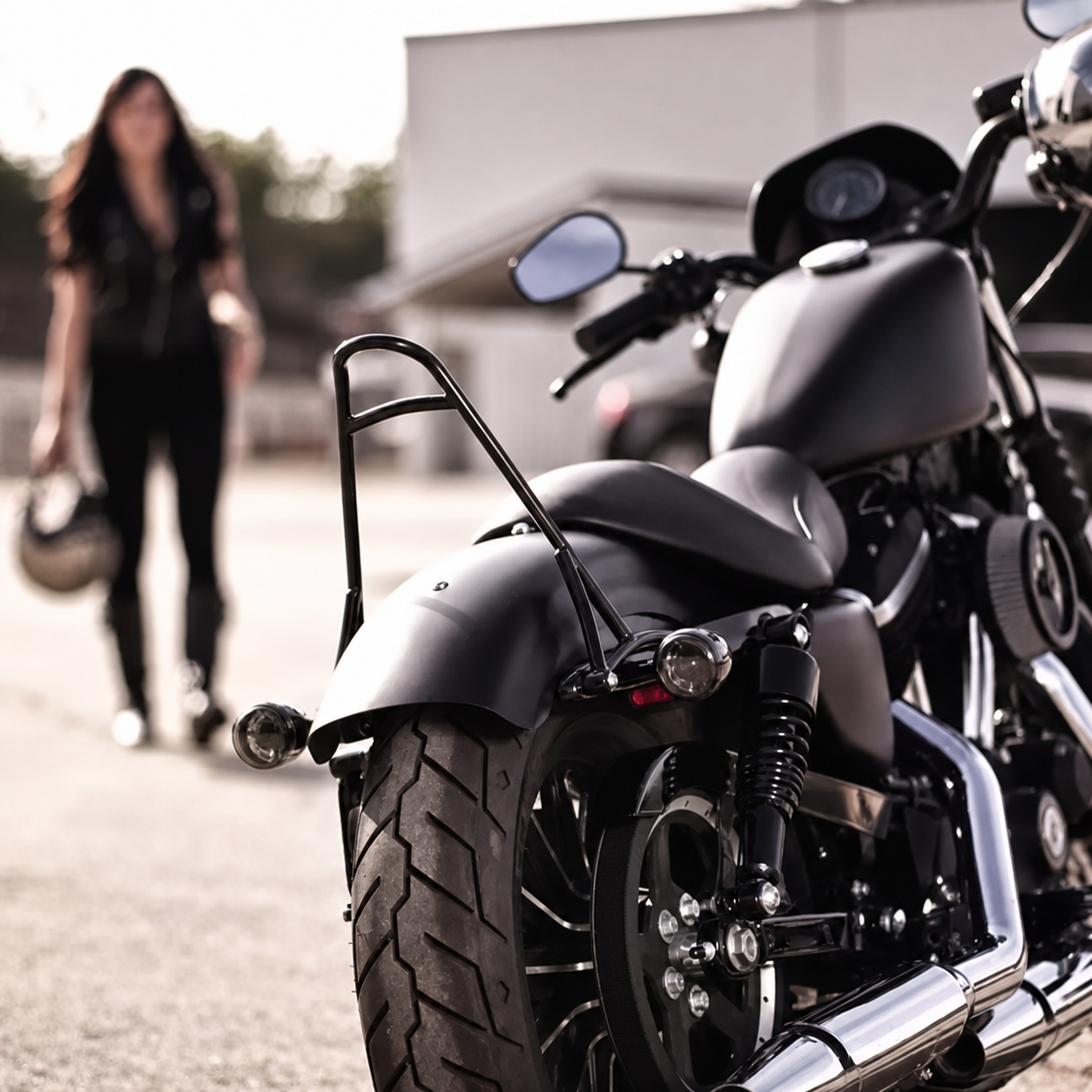 Black tall passenger backrest installed on a motorcycle
