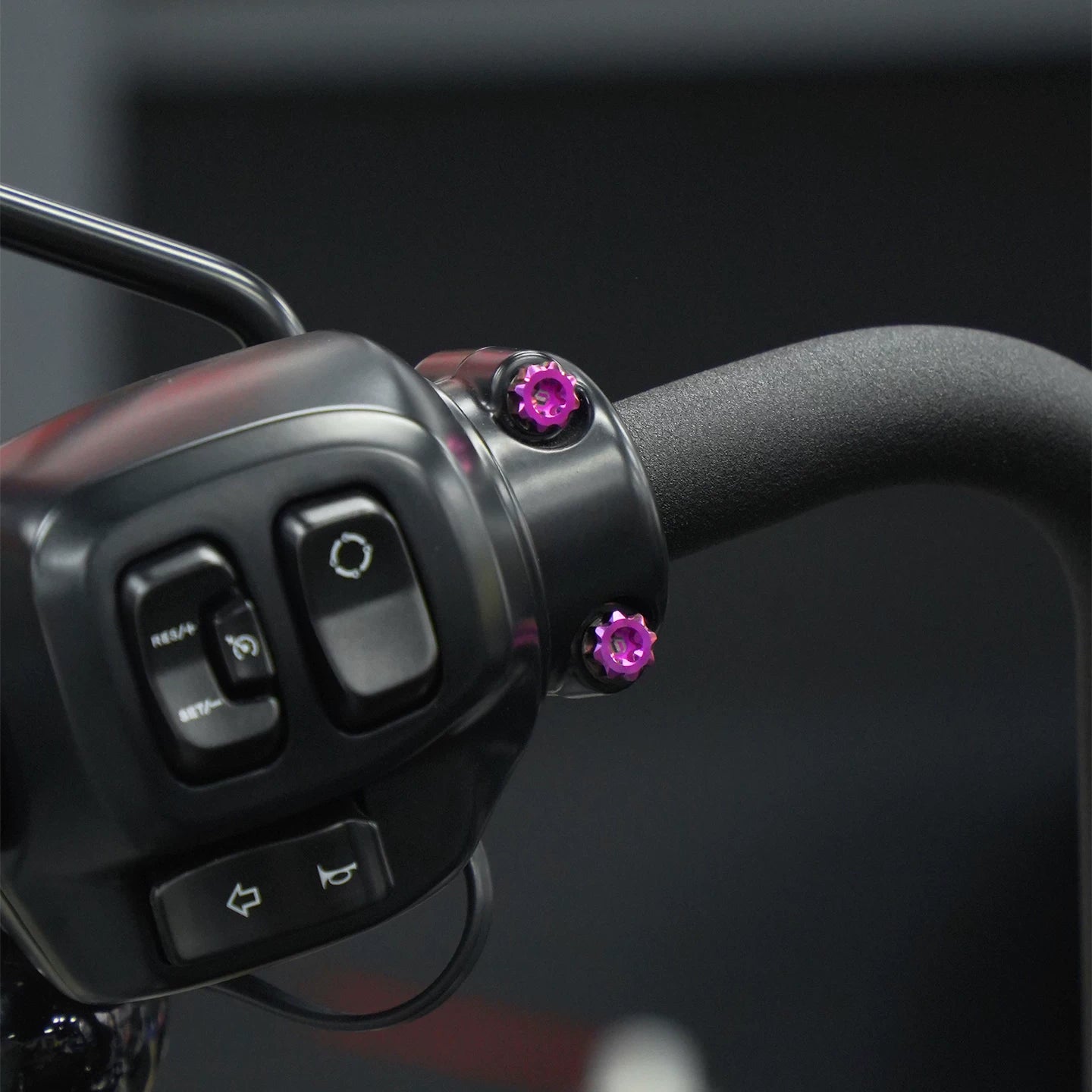 Purple titanium handlebar clamp bolts installed