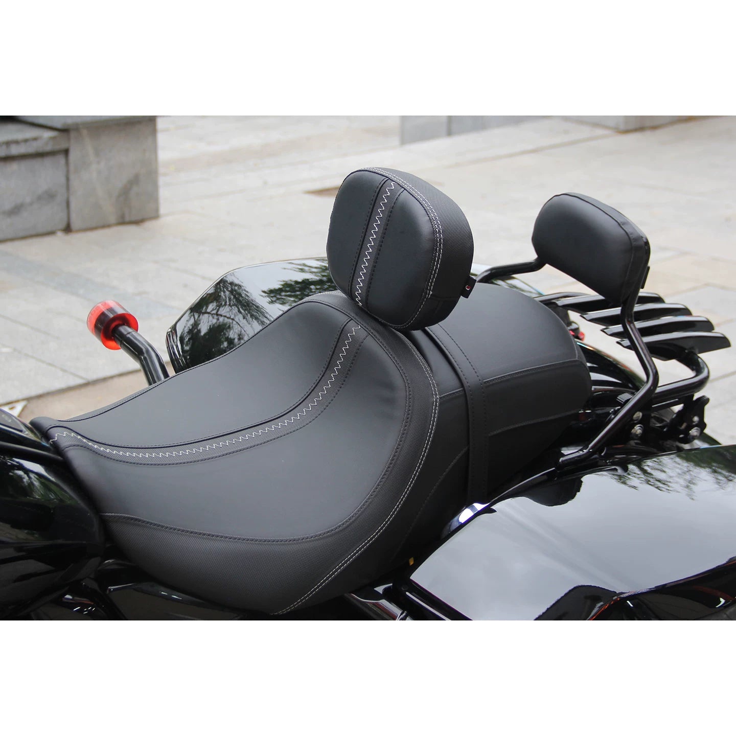 Adjustable rider backrest installed behind the front seat