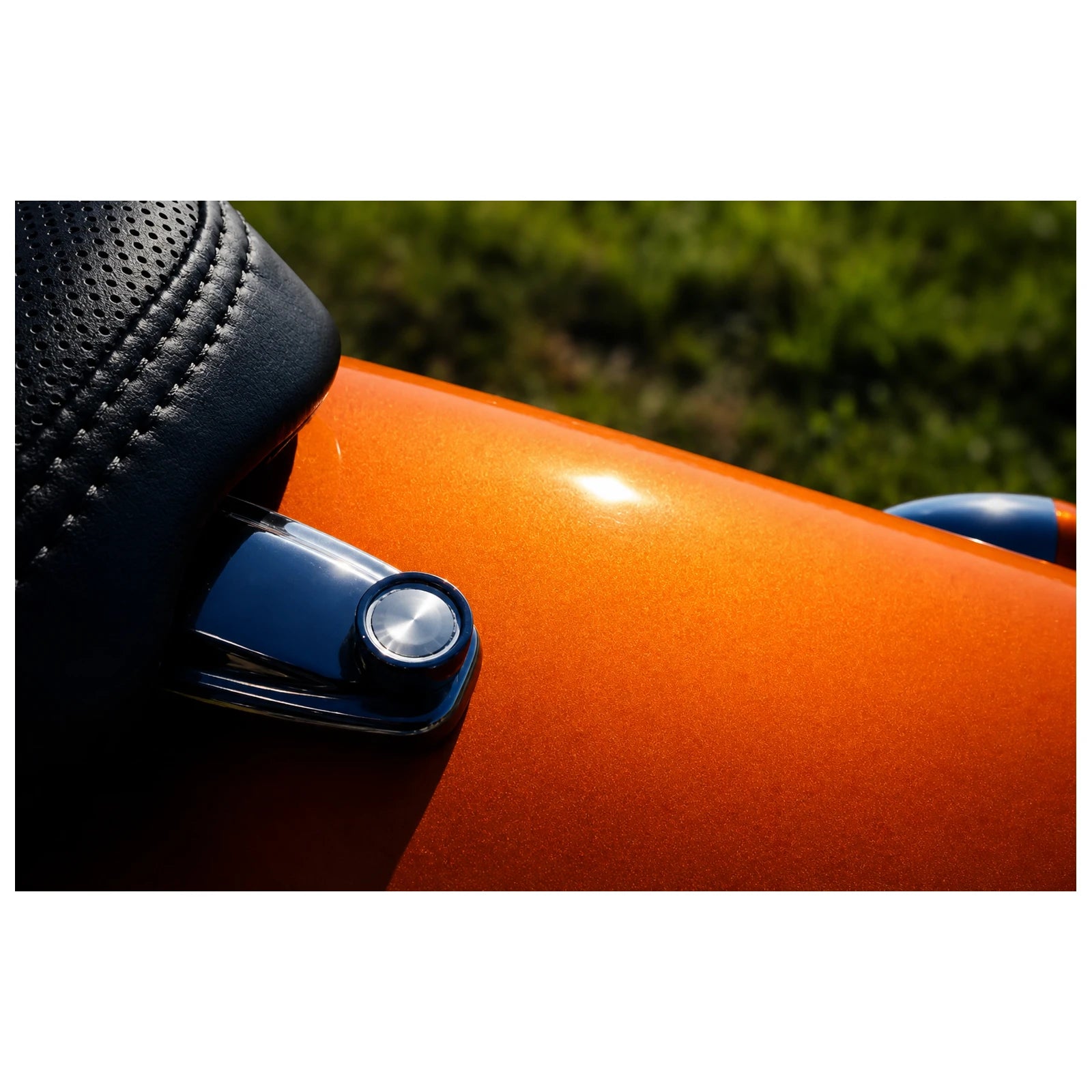 Chrome seat quick-release screw installed on motorcycle