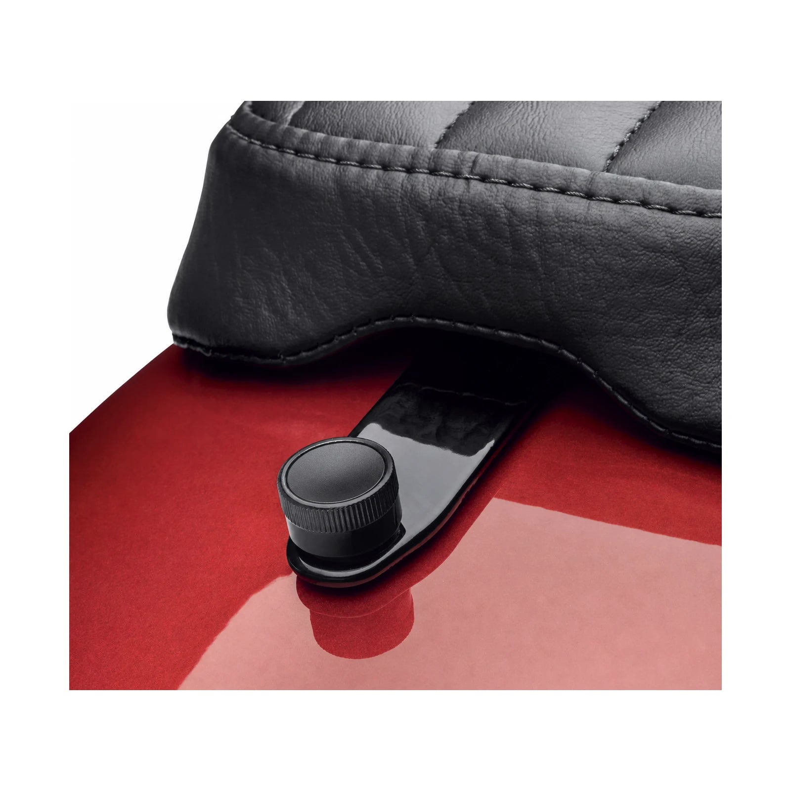 Black seat quick-release screw installed under motorcycle seat
