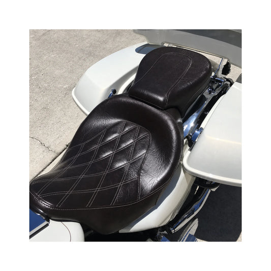 Front and rear motorcycle seats installed on white touring motorcycle