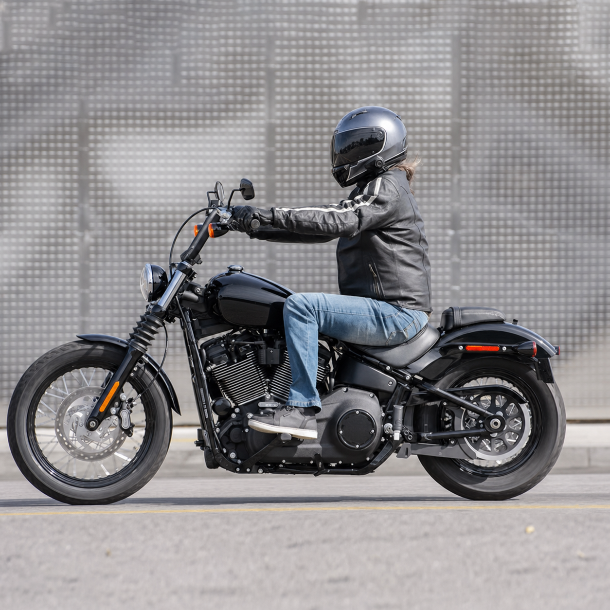 Motorcycle rider with channel-stitched passenger seat