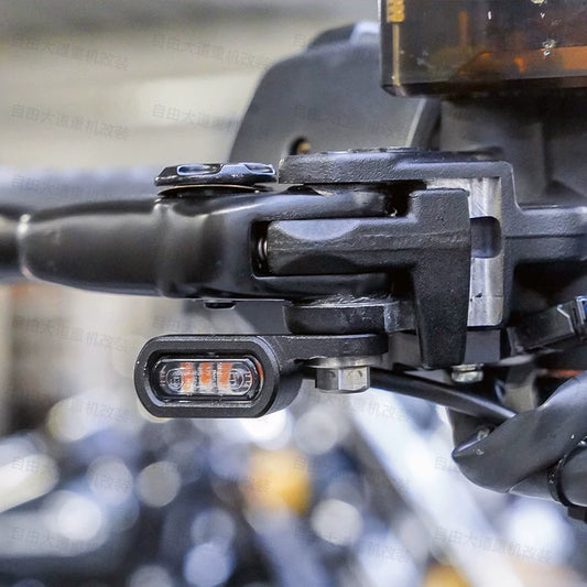 Mini LED turn signal installed on motorcycle handlebar