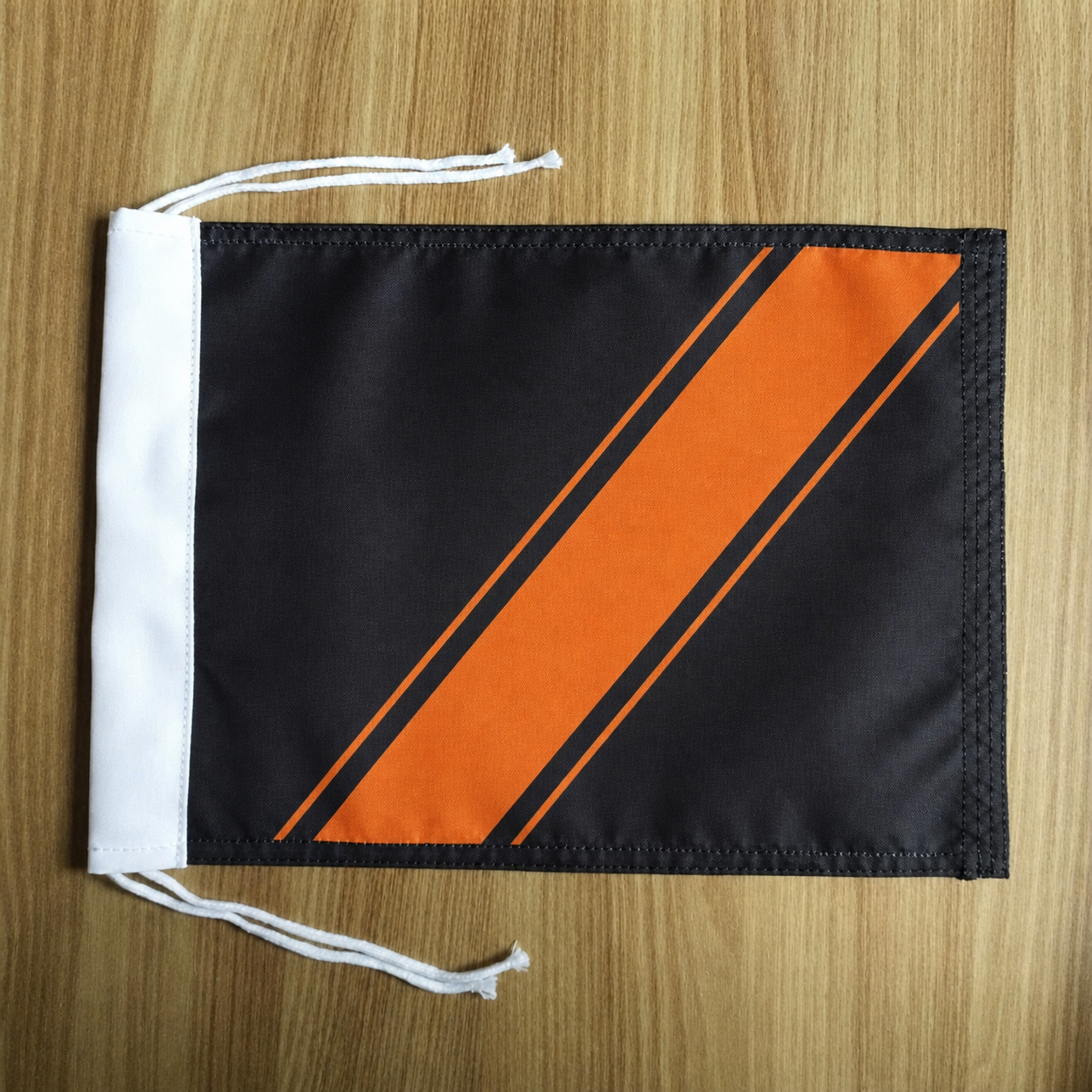 Small unbranded black-and-orange motorcycle flag
