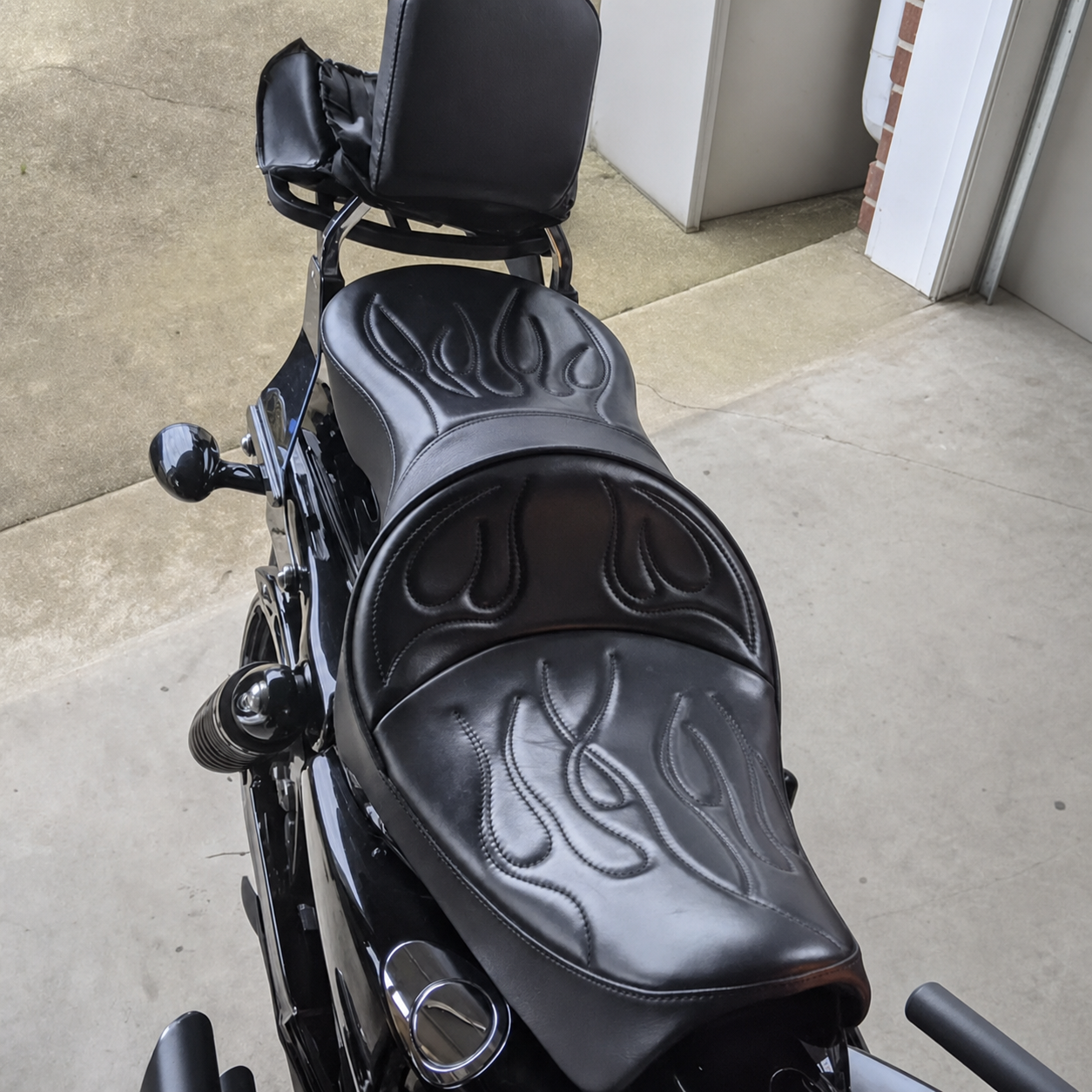 Flame-stitched two-up seat installed on motorcycle