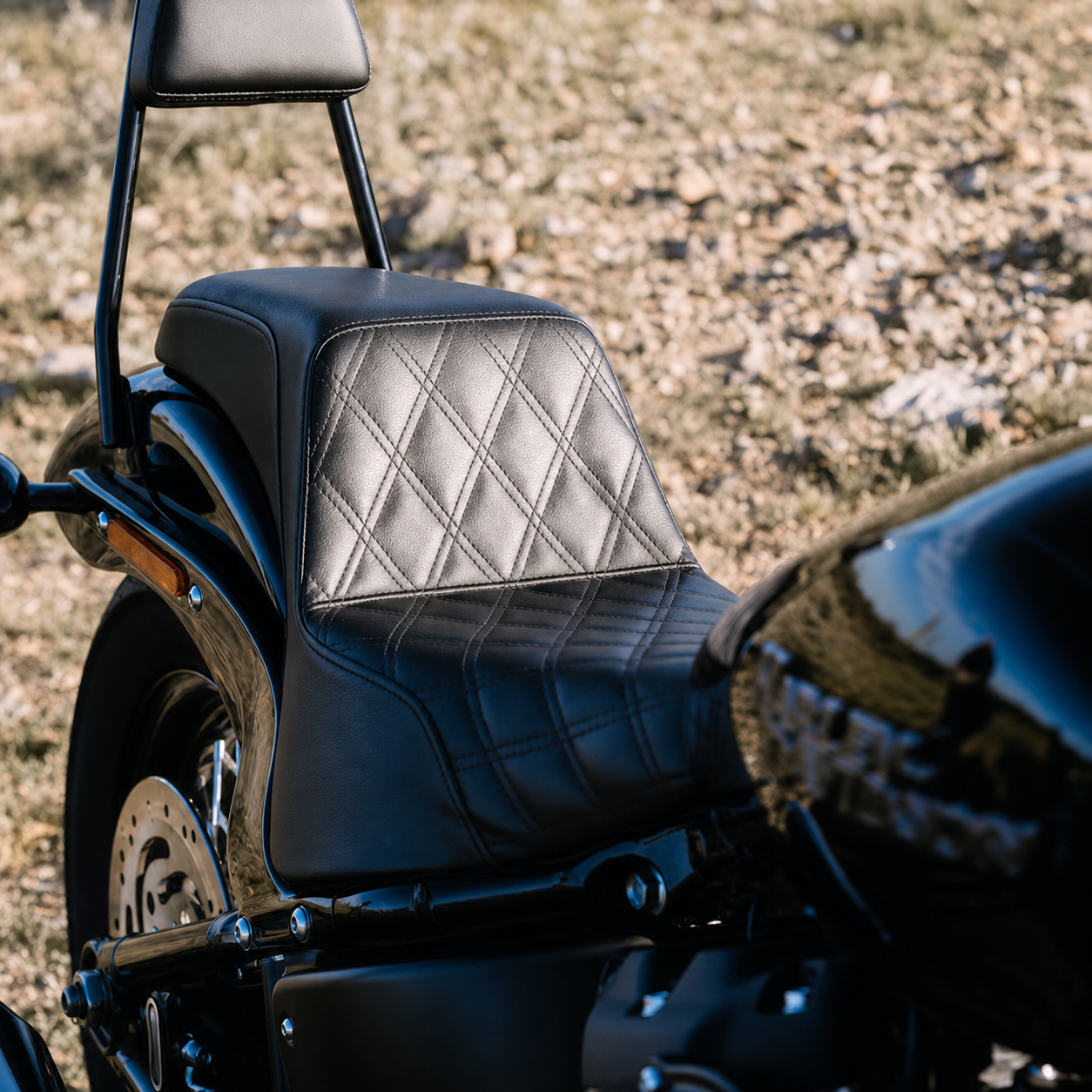 Stepped two-up motorcycle seat for Harley Softail
