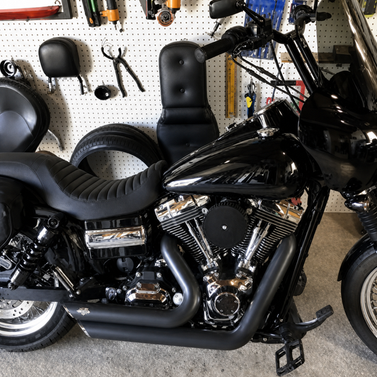 Ribbed two-up seat on black motorcycle