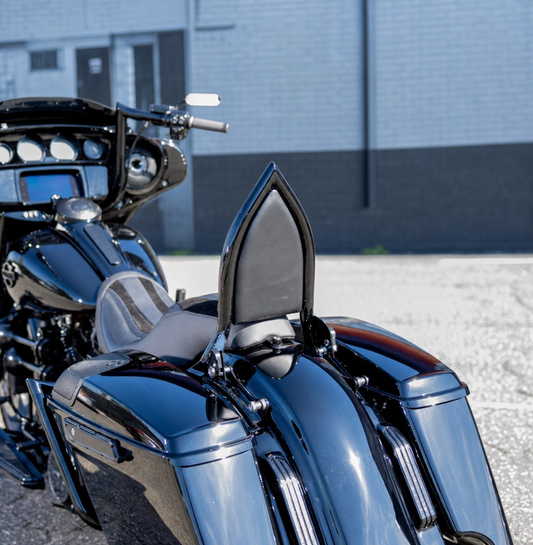 Black pointed passenger backrest installed on Harley Touring