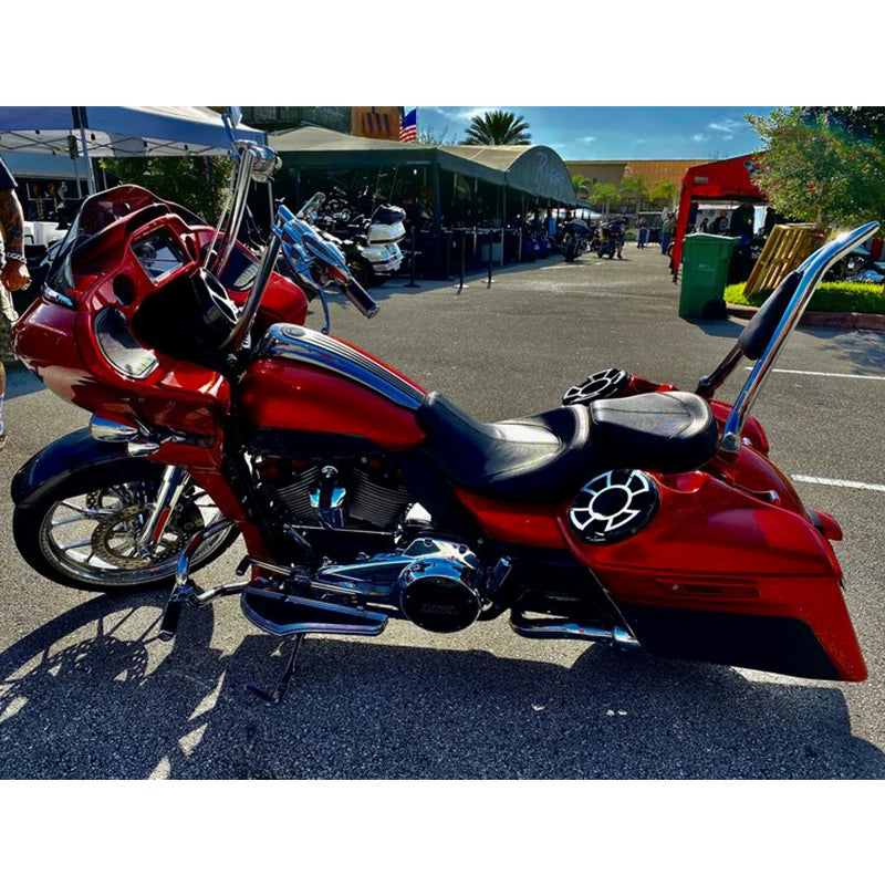 Chrome pointed sissy bar installed on red touring motorcycle