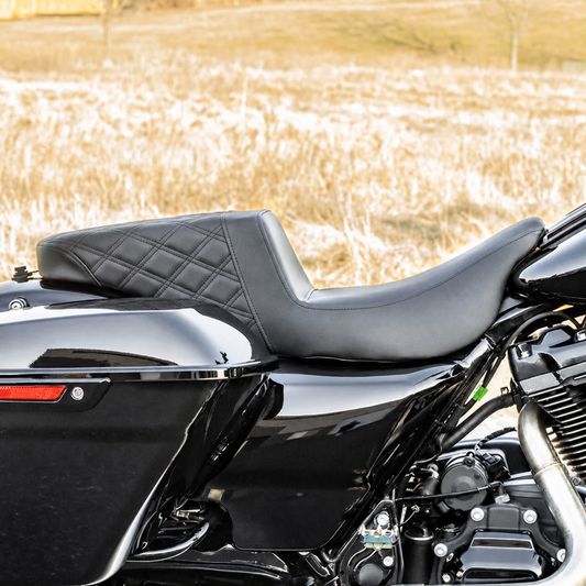 Stepped touring seat installed on a motorcycle