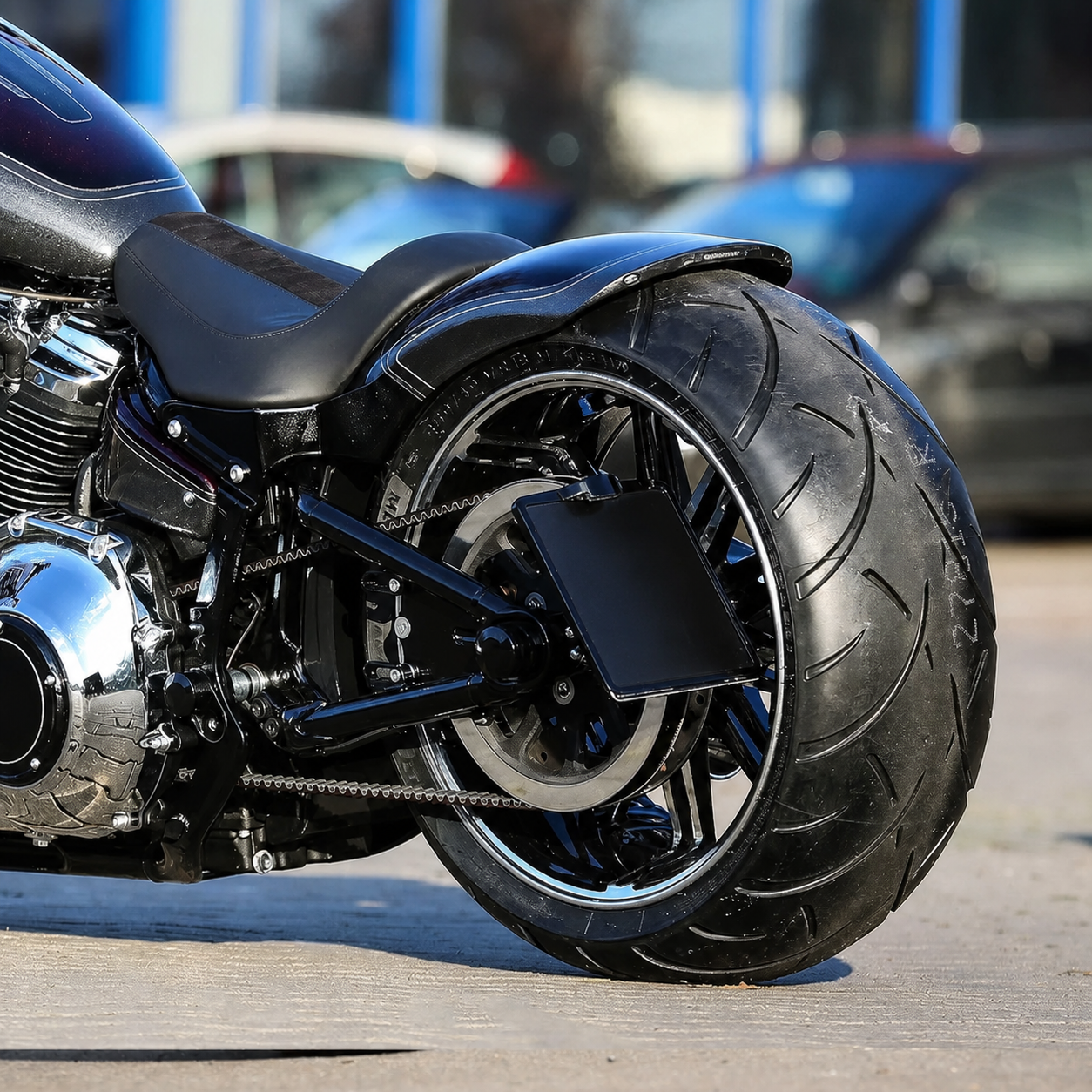 Wide rear tire conversion installed, side view