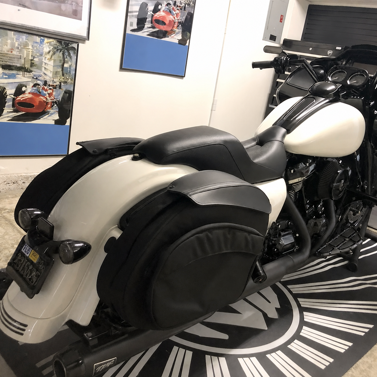 Narrow touring seat installed on motorcycle indoors