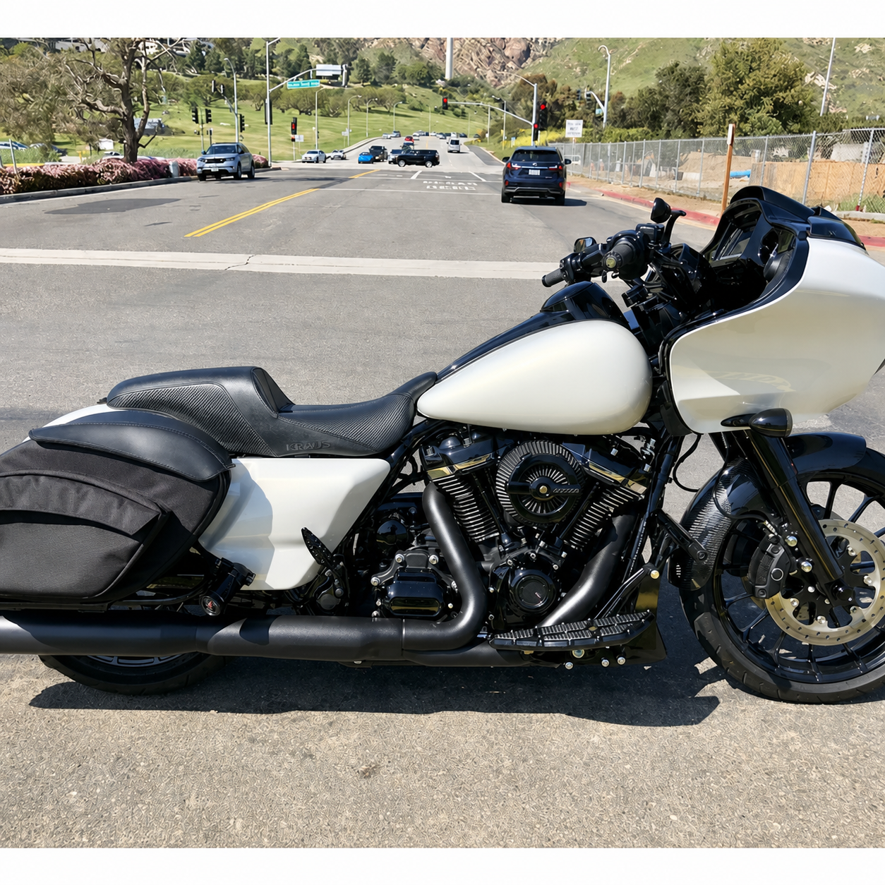 Narrow touring seat installed on motorcycle outdoors