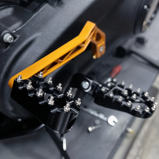 Unbranded black CNC motorcycle foot pegs installed