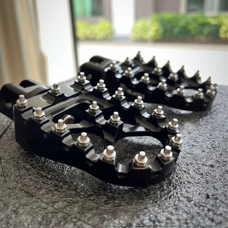 Pair of black CNC spiked motorcycle foot pegs