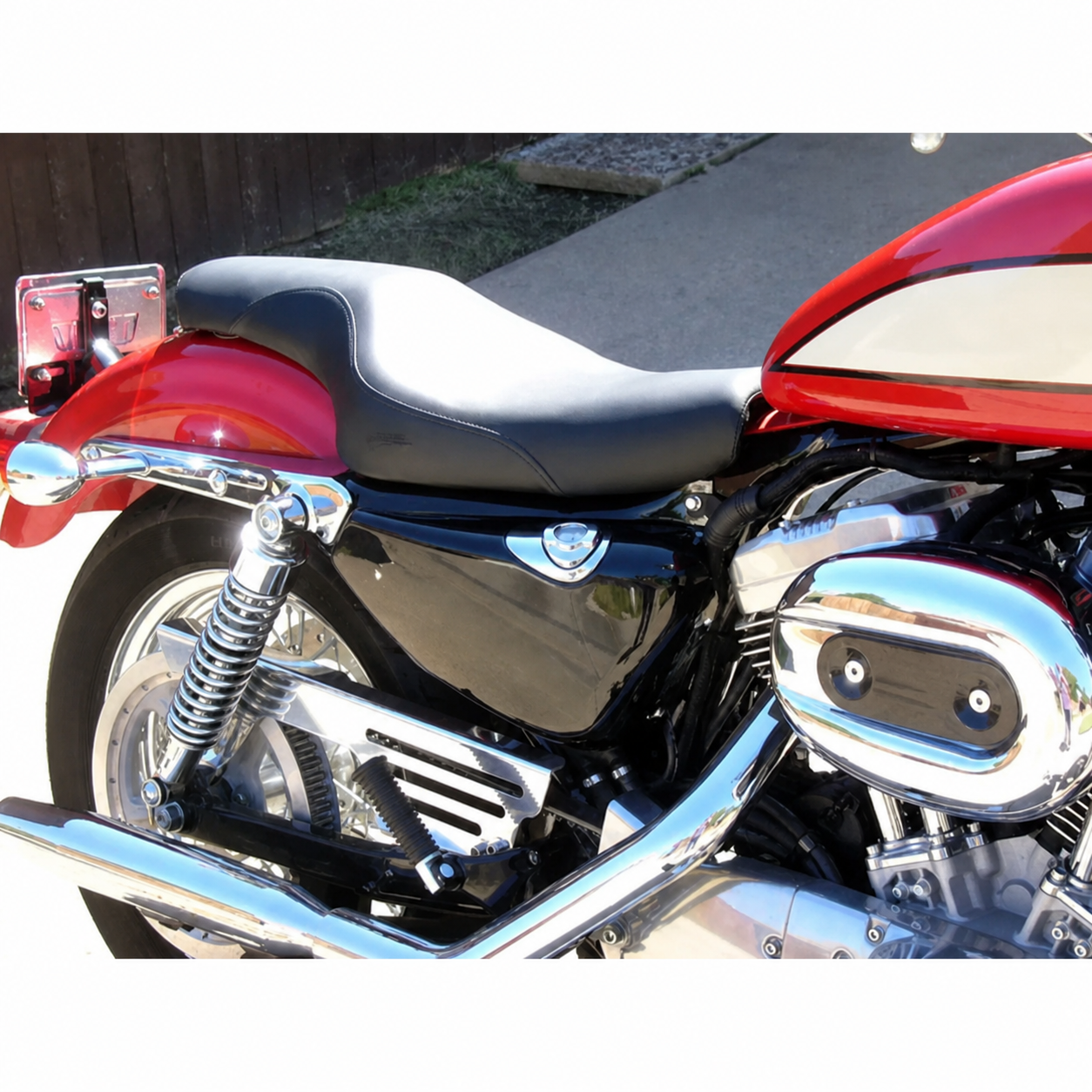 Two-up seat installed on red motorcycle