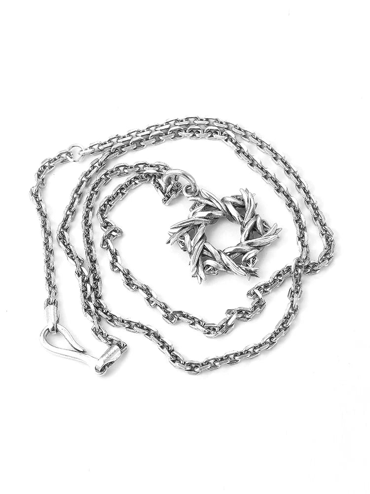 Thorn wrapped hexagram pendant shown with sterling silver chain