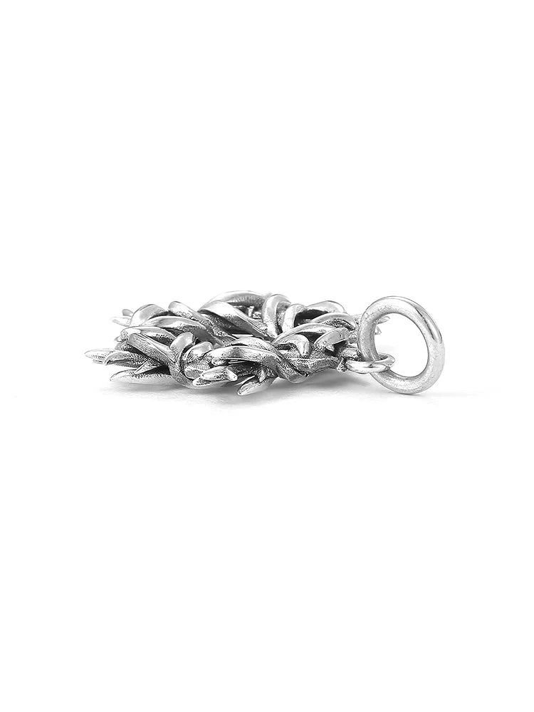 Side profile of thorn wrapped hexagram biker pendant