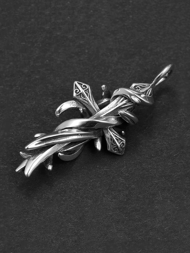 Side detail of thorn wrapped vintage cross biker pendant