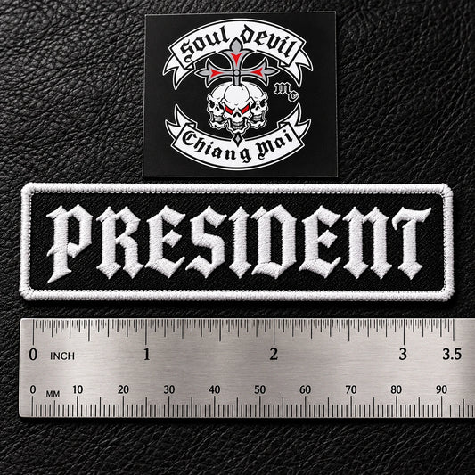Compact 3.5 by 1 inch motorcycle club officer patch.