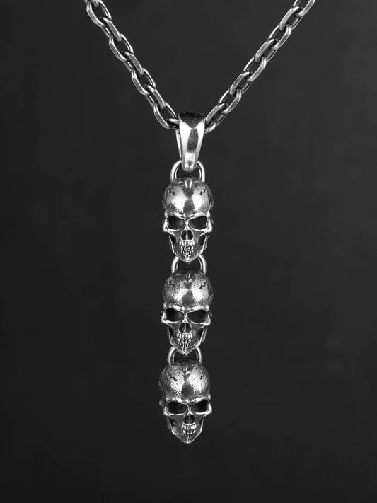 Three linked skulls sterling silver biker pendant front view