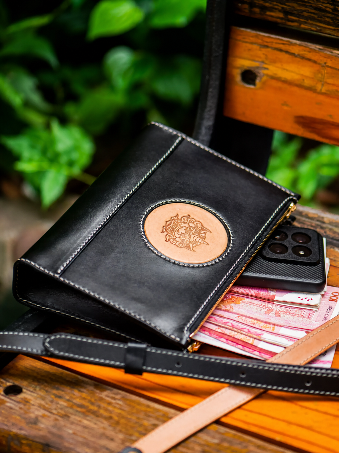 black leather biker clutch with phone and cash capacity