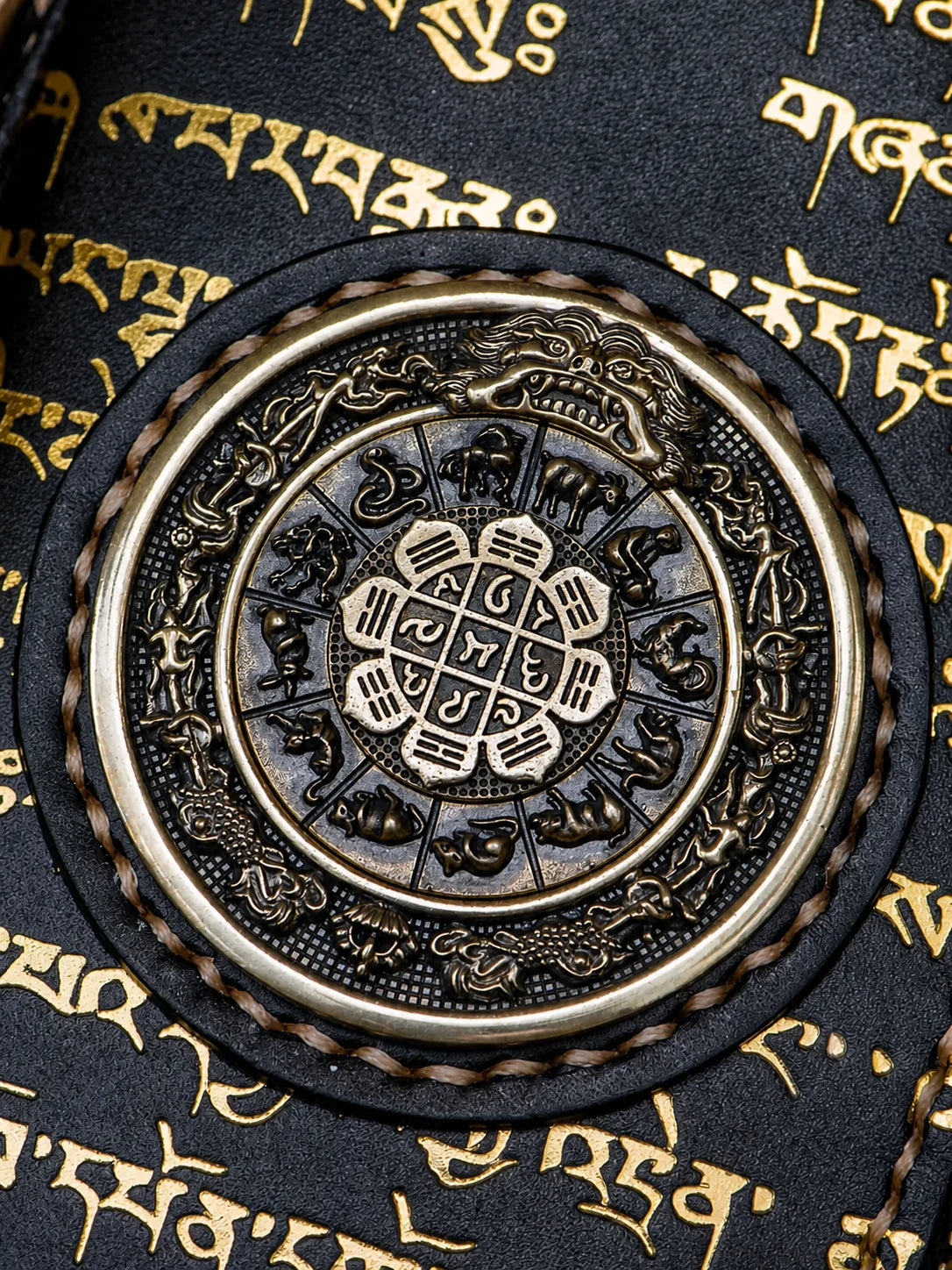 zodiac medallion close-up on black top-grain leather wallet