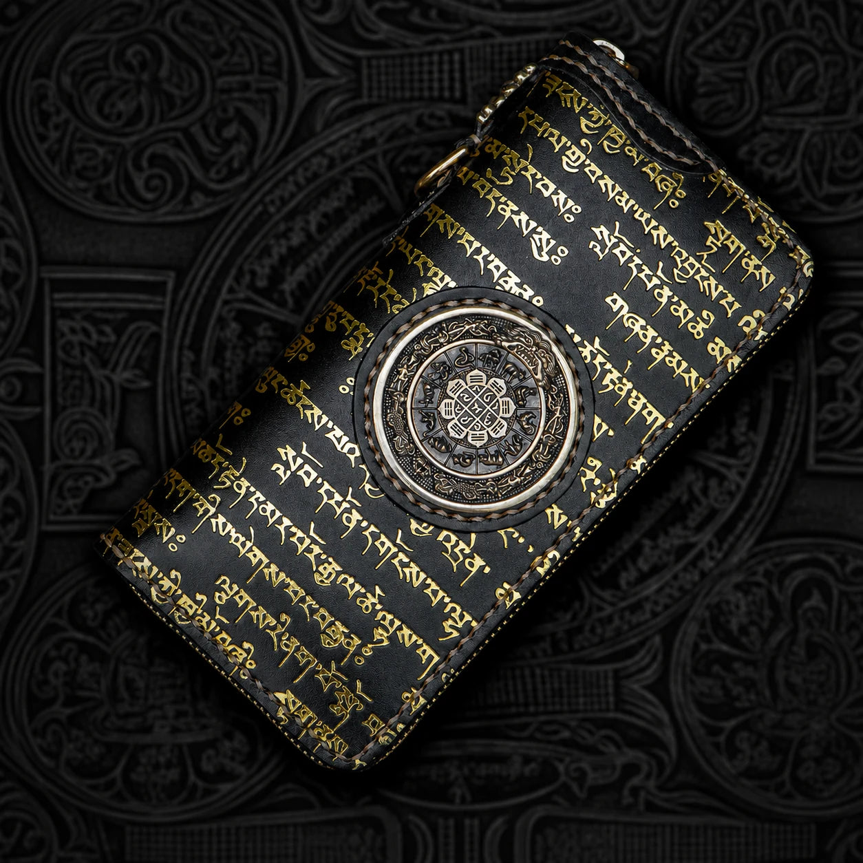 black zodiac medallion leather biker wallet on carved background