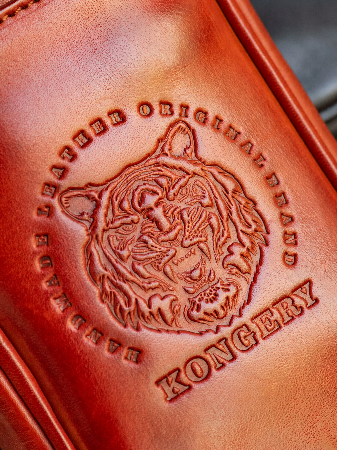 close-up embossed tiger artwork on full-grain leather biker wallet