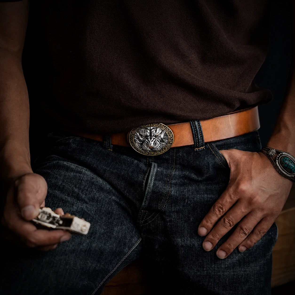 tiger head biker belt buckle worn with a brown saddle leather belt