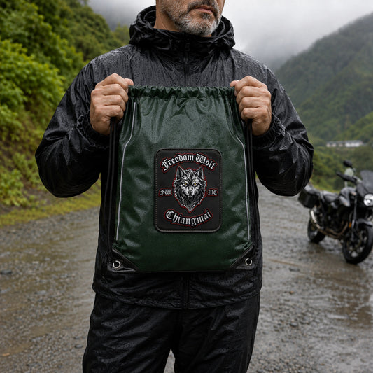 Touring rider holds a realistically sized reinforced motorcycle club drawstring backpack.