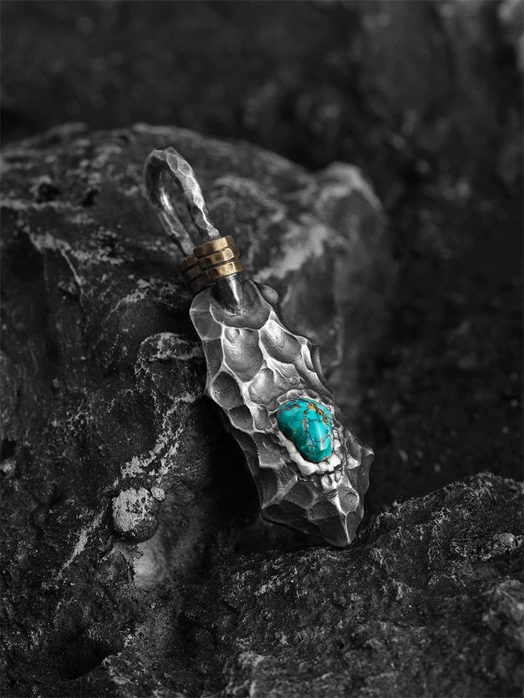 Turquoise dragon-scale sterling silver biker pendant, angled view