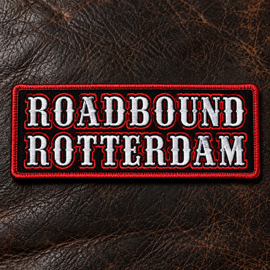 Two-line motorcycle club name bar balancing a road name above a chapter identifier without compressed lettering, showing custom motorcycle club name bar patch options.