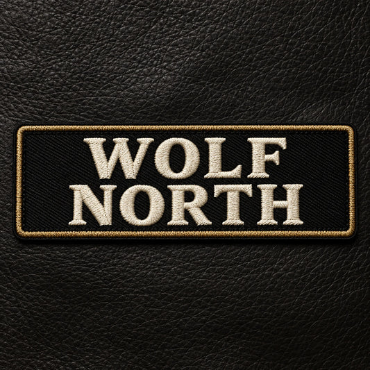 Two-line motorcycle club name bar balancing a road name above a chapter identifier without compressed lettering, showing custom motorcycle club name bar patch options.