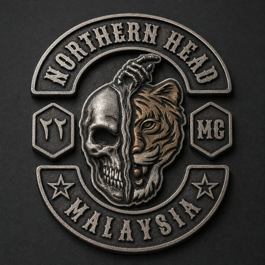One-piece NORTHERN HEAD pin with a sculpted half-skull and half-tiger center in antique silver and aged bronze.