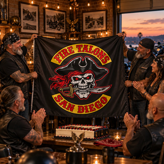 Adult motorcycle club members unveiling a custom flag during a milestone celebration.