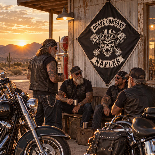 Veteran American V-twin riders gather beneath their custom diamond flag at a desert service station.