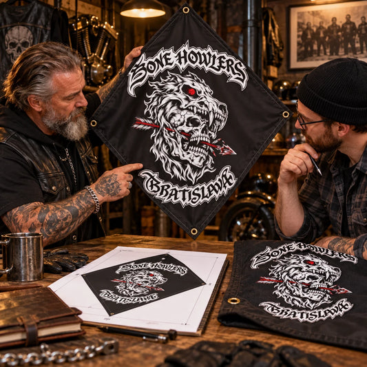 A motorcycle club road captain reviews a custom diamond flag proof and fabric sample at a clubhouse table.