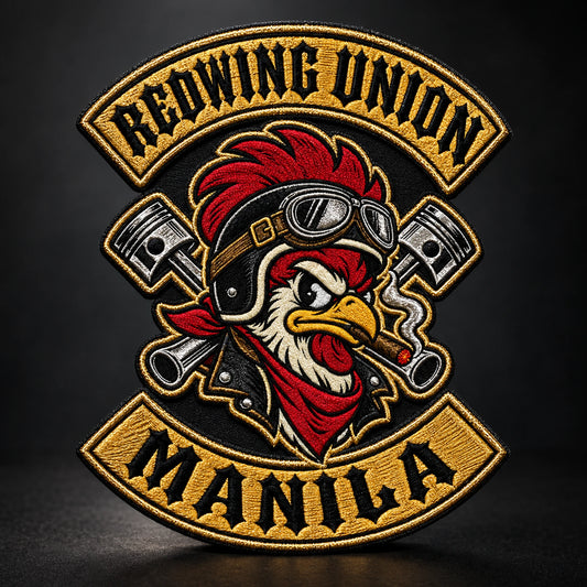 Motorcycle club metallic-thread embroidered anniversary patch featuring the authorized Redwing Union Manila identity in a controlled studio light catching metallic fibers.